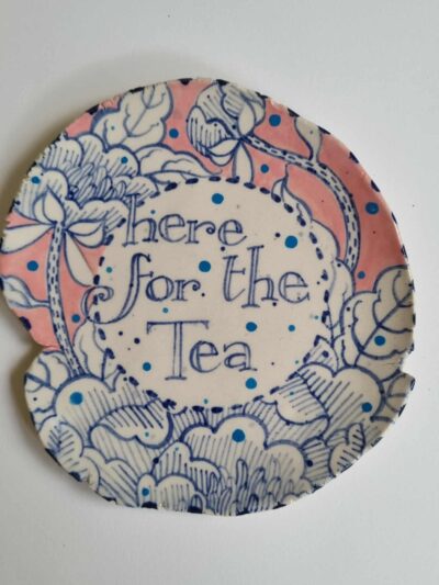 Here for the tea platter. Platter Coloured underglazes on midfire white clay. Slab form. Clear glaze. Has attached hanging device